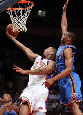 NEW YORK - NOVEMBER 14:  Wilson Chandler #21 of the New York Knicks lays the ball up against Russell Westbrook #0 of the Oklahoma City Thunder on November 14, 2008 at Madison Square Garden in New York City.  NOTE TO USER: User expressly acknowledges and a