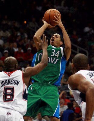 ATLANTA - NOVEMBER 02:  Devin Harris #34 of the Dallas Mavericks shoots over Anthony Johnson #8 of the Atlanta Hawks at Philips Arena November 2,  2007 in Atlanta, Georgia. NOTE TO USER: User expressly acknowledges and agrees that, by downloading and or u