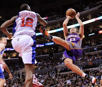 LOS ANGELES, CA - FEBRUARY 18:  Steve Nash #13 of the Phoenix Suns throws up a shot as he falls backwards against Al Thornton #12 of the Los Angeles Clippers during the first quarter at the Staples Center February 18, 2009, in Los Angeles, California. NOT