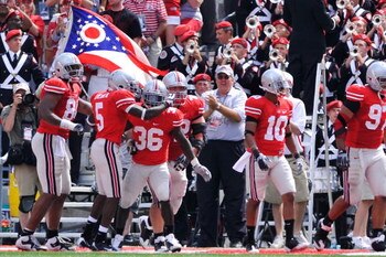 COLUMBUS, OH - SEPTEMBER 05:  Ohio State Buckeyes players congratulate Brian Rolle #36 of the Buckeyes after Rolle intercepted a Navy Midshipmen two-point conversion attempt and returned it 100 yards to the Navy endzone at Ohio Stadium on September 5, 200