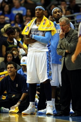 DENVER - MAY 29:  Carmelo Anthony #15 of the Denver Nuggets looks on from the bench in the fourth quarter of Game Six of the Western Conference Finals during the 2009 NBA Playoffs against the Los Angeles Lakers at Pepsi Center on May 29, 2009 in Denver, C