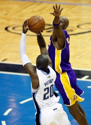 ORLANDO, FL - JUNE 11:  Mickael Pietrus #20 of the Orlando Magic attempts a game-winning shot over Lamar Odom #7 in the fourth quarter of Game Four of the 2009 NBA Finals on June 11, 2009 at Amway Arena in Orlando, Florida.  NOTE TO USER:  User expressly 