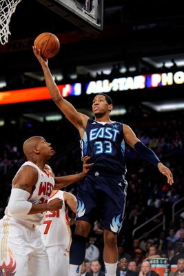 PHOENIX - FEBRUARY 15:  Danny Granger #33 of the Eastern Conference lays the ball up over David West #30 of the Western Conference during the 58th NBA All-Star Game, part of 2009 NBA All-Star Weekend at US Airways Center on February 15, 2009 in Phoenix, A