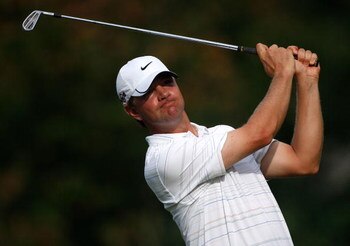 GREENSBORO, NC - AUGUST 20:  Lucas Glover watches his tee shot on the 3rd hole during the first round of the Wyndham Championship at Sedgefield Country Club on August 20, 2009 in Greensboro, North Carolina  (Photo by Streeter Lecka/Getty Images)