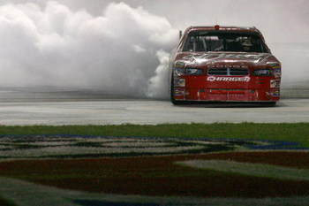 HAMPTON, GA - SEPTEMBER 06: Kasey Kahne, driver of the #9 Budweiser Dodge performs a burnout after winning the NASCAR Sprint Cup Series Pep Boys Auto 500 at Atlanta Motor Speedway on September 6, 2009 in Hampton, Georgia. (Photo by Jason Smith/Getty Ima
