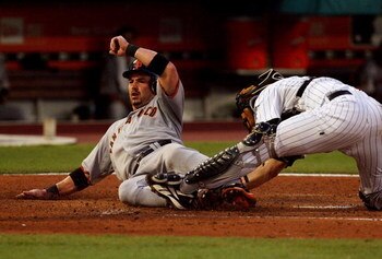 MIAMI - MAY 23:  Catcher Matt Treanor #20 of the Florida Marlins can't block the plate as Aaron Rowand #33 of the San Francisco Giants scores on a double by Rich Aurilia #35 in the third inning at Dolphin Stadium on May 23, 2008 in Miami, Florida.  (Photo