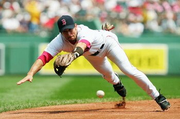 BOSTON - JULY 22:   (FILE PHOTO )  Nomar Garciaparra #5 of the Boston Red Sox dives for a ball hit by Jerry Hairston #15 of the Baltimore Orioles in the second inning July 22, 2004 at Fenway Park in Boston, Massachusetts. After spending nine-years in Bost