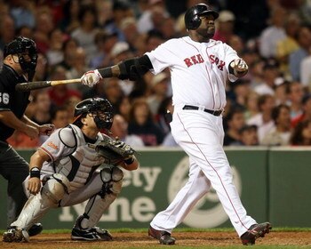 BOSTON - SEPTEMBER 08:  David Ortiz #34 of the Boston Red Sox hits a solo home run in the seventh inning as Matt Wieters #15 of the Baltimore Orioles defends on September 8, 2009 at Fenway Park in Boston, Massachusetts.  (Photo by Elsa/Getty Images)