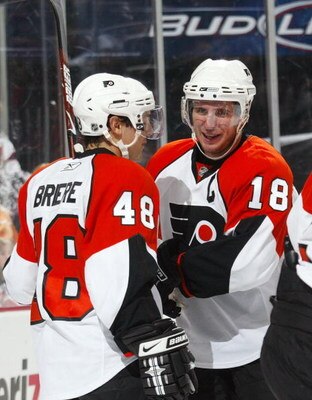 NEWARK, NJ - OCTOBER 04: Daniel Briere #48 (L0 and Mike Richards #18 (R) of the Philadelphia Flyers celebrate Briere's third period goal against the New Jersey Devils on October 4, 2008 at the Prudential Center in Newark, New Jersey. The Devils defetaed t