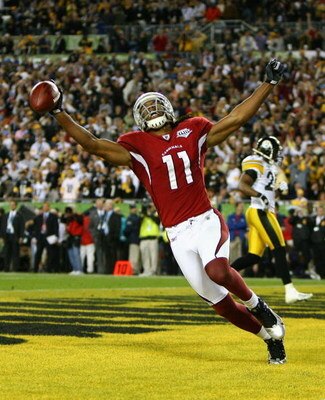 TAMPA, FL - FEBRUARY 01:  Larry Fitzgerald #11 of the Arizona Cardinals celebrates after scoring a touchdown in the fourth quarter against the Pittsburgh Steelers during Super Bowl XLIII on February 1, 2009 at Raymond James Stadium in Tampa, Florida.  (Ph