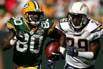 GREEN BAY, WI - SEPTEMBER 23: Donald Driver #80 of the Green Bay Packers is chased by Drayton Florence #29 of the San Diego Chargers after catching a pass at Lambeau Field September 23, 2007 in Green Bay, Wisconsin.  (Photo by Matthew Stockman/Getty Image