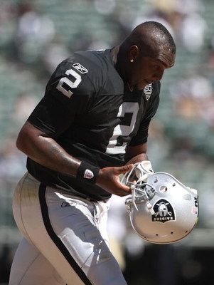 OAKLAND, CA - AUGUST 29:  Quarterback JaMarcus Russell #2 of the Oakland Raiders looks on against the New Orleans Saints during an NFL preseason game at Oakland-Alameda County Coliseum on August 29, 2009 in Oakland, California.  (Photo by Jed Jacobsohn/Ge