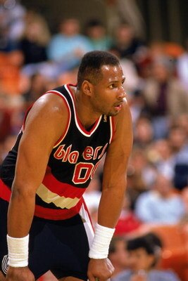 LOS ANGELES - 1990:  Kevin Duckworth #00 of the Portland Trail Blazers rests before the 1989-1990 NBA season game against the Los Angeles Lakers at the Great Western Forum in Los Angeles, California.  (Photo by: Mike Powell/Getty Images) 