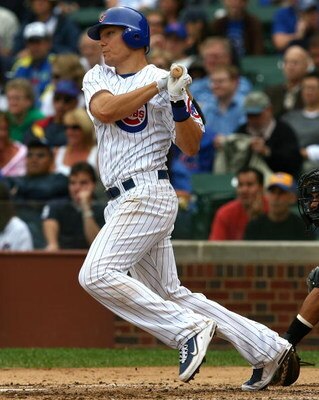 CHICAGO - AUGUST 28: Jeff Baker #28 of the Chicago Cubs hits the ball against the New York Mets on August 28, 2009 at Wrigley Field in Chicago, Illinois. The Cubs defeated the Mets 5-2. (Photo by Jonathan Daniel/Getty Images)