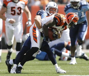CINCINNATI - SEPTEMBER 14:  Cortland Finnegan #31 of the Tennessee Titans tackles Chad Johnson #85 of the Cincinnati Bengals during the second quarter of their NFL game September 14, 2008 at Paul Brown Stadium in Cincinnati, Ohio. The Titans defeated the 