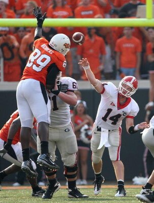 STILLWATER, OK - SEPTEMBER 05:  Quarterback Joe Cox #14 of the Georgia Bulldogs throws a pass that is deflected by tight end Cooper Bassett #80 of the Oklahoma State Cowboys during the college football game at Boone Pickens Stadium on September 5, 2009 in
