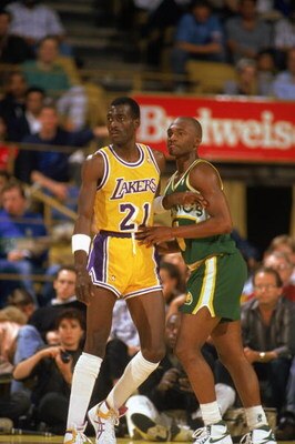 LOS ANGELES - 1990:  Sedale Threatt #4 of the Seattle Supersonics and Michael Cooper #21 of the Los Angeles Lakers battle for position during a game in the 1989-1990 NBA season at the Great Western Forum in Los Angeles, California.  (Photo by Ken Levine/G