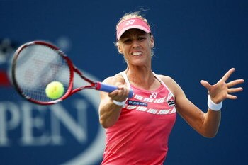 NEW YORK - SEPTEMBER 03:  Elena Dementieva of Russia returns a shot against Melanie Oudin during day four of the 2009 U.S. Open at the USTA Billie Jean King National Tennis Center on September 3, 2009 in Flushing neighborhood of the Queens borough of New 