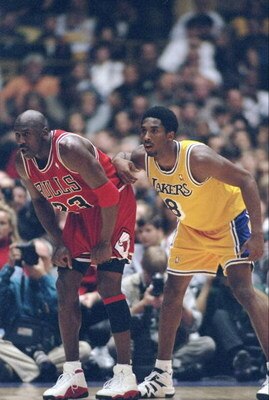1 Feb 1998:  Guard Michael Jordan of the Chicago Bulls (left) and guard Kobe Bryant of the Los Angeles Lakers look on during a game at the Great Western Forum in Inglewood, California.  The Lakers won the game, 112-87. Mandatory Credit: Jed Jacobsohn  /Al