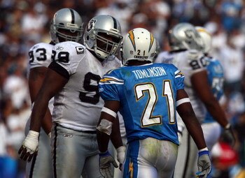 SAN DIEGO - OCTOBER 14:  Runningback LaDainian Tomlinson #21 of the San Diego Chargers has words with Warren Sapp #99 of the Oakland Raiders during the second half of their NFL game on October 14, 2007 at Qualcomm Stadium in San Diego, California.  (Photo