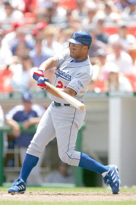 WASHINGTON ? MAY 28:  Outfielder Jose Cruz Jr. #22 of the Los Angeles Dodgers swings at a Washington Nationals pitch on May 28, 2006 at RFK Stadium in Washington, DC. The Nationals won 10-4.  (Photo by Jamie Squire/Getty Images) 