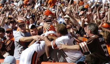 CLEVELAND - AUGUST 21:  Running back Lee Suggs #44 of the Cleveland Browns is welcomed into the Dawg Pound after scoring a touchdown during the second quarter of the pre-season game between the Cleveland Browns and the Detroit Lions on August 21, 2004 at 
