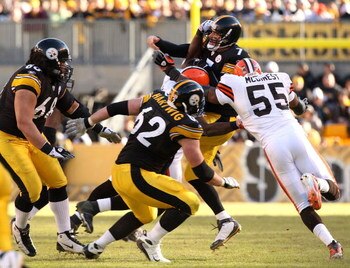 PITTSBURGH - DECEMBER 28:  Ben Roethlisberger #7 of the Pittsburgh Steelers is hit after a second quarter pass by Willie McGinest #55 of the Cleveland Browns which led to Roethlisberger being taken off the field on a stretcher on December 28, 2008 at Hein