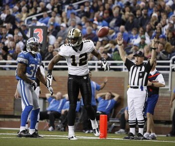DETROIT - DECEMBER 21: Wide receiver Marques Colston #12 of the New Orleans Saints scores on a six yard pass in the third quarter against the Detroit Lions on December 21, 2008 at Ford Field in Detroit, Michigan. The New Orleans Saints defeated the Detroi
