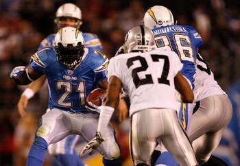 SAN DIEGO - DECEMBER 04:  Running Back LaDainian Tomlinson #21 of the San Diego Chargers rushes against the Oakland Raiders during their NFL Game on December 4, 2008 at Qualcomm Stadium in San Diego, California.  (Photo by Harry How/Getty Images)
