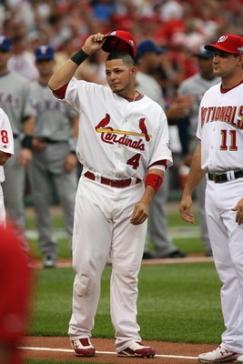ST. LOUIS, MO - JULY 14:  National League All-Star Yadier Molina of the St. Louis Cardinals tips his hat during introductions before the 2009 MLB All-Star Game at Busch Stadium on July 14, 2009 in St. Louis, Missouri. (Photo by Dilip Vishwanat/Getty Image