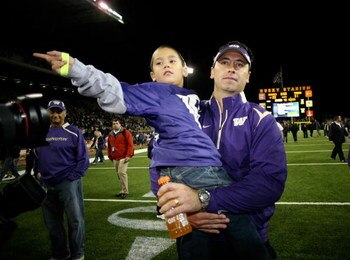 SEATTLE - SEPTEMBER 05:  Head coach Steve Sarkisian of the Washington Huskies leaves the field with son Brady after losing to the LSU Tigers 31-23 on September 5, 2009 at Husky Stadium in Seattle, Washington. (Photo by Otto Greule Jr/Getty Images)