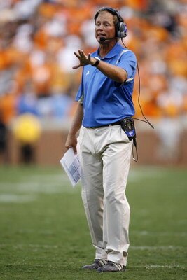 KNOXVILLE, TN - SEPTEMBER 12: Rick Neuheisel, head coach of the UCLA Bruins coaches against the Tennessee Volunteers on September 12, 2009 at Neyland Stadium in Knoxville, Tennessee. The Bruins beat the Volunteers 19-15. (Photo by Joe Murphy/Getty Images)