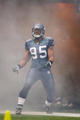 SEATTLE - DECEMBER 07:  Lawrence Jackson #95 of the Seattle Seahawks celebrates as he enters the field before the game against the New England Patriots on December 7, 2008 at Qwest Field in Seattle, Washington. The Patriots defeated the Seahawks 24-21. (P