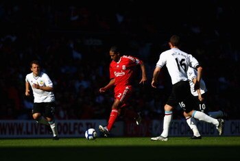LIVERPOOL, ENGLAND - SEPTEMBER 12:  Glen Johnson of Liverpool takes on the  Burnley defenders during the Barclays Premier League match between Liverpool and Burnley at Anfield on September 12, 2009 in Liverpool, England.  (Photo by Ryan Pierse/Getty Image