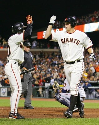 SAN FRANCISCO - AUGUST 07:  Pitcher Matt Cain #18 is congratulated by teammate Dave Roberts #10 of the San Francisco Giants after hitting a homerun in the fifth inning against the Washington Nationals on August 7, 2007 at AT&T Park in San Francisco, Calif