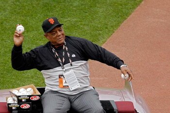 SAN FRANCISCO - JULY 10:  Baseball Hall-of-Famer Willie Mays #24 of the San Francisco Giants throws out baseballs after being honored prior to the 78th Major League Baseball All-Star Game at AT&T Park on July 10, 2007 in San Francisco, California.  (Photo
