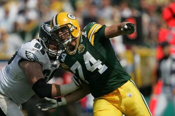 GREEN BAY, WI - SEPTEMBER 09: Aaron Kampman #74 of the Green Bay Packers rushes against Jon Runyan #69 of the Philadelphia Eagles on September 9, 2007 at Lambeau Field in Green Bay, Wisconsin. The Packers defeated the Eagles 16-13. (Photo by Jonathan Dani