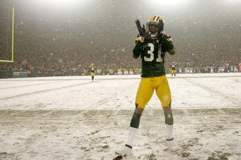 GREEN BAY, WI - JANUARY 12:  Cornerback Al Harris #31 of the Green Bay Packers cheers from the sideline in the fourth quarter against the Seattle Seahawks during the NFC divisional playoff game on January 12, 2008 at Lambeau Field in Green Bay, Wisconsin.