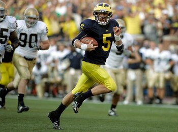 ANN ARBOR, MI - SEPTEMBER 12:  Quarterback Tate Forcier #5 of Michigan runs for a touchdown late in the fourth quarter against Notre Dame at Michigan Stadium on September 12, 2009 in Ann Arbor, Michigan.  (Photo by Domenic Centofanti/Getty Images)