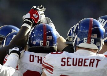 SEATTLE - NOVEMBER 27:  The New York Giants huddle during the game against the Seattle Seahawks at Qwest Field on November 27, 2005 in Seattle, Washington. The Seahawks won 24-21.  (Photo by Otto Greule Jr/Getty Images)