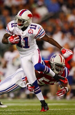 FOXBORO, MA - SEPTEMBER 14:  Eric Alexander #52 of the New England Patriots tries to stop wide receiver Roscoe Parrish #11 of the Buffalo Bills as he carries the ball during the second quarter on September 14, 2009 at Gillette Stadium in Foxboro, Massachu