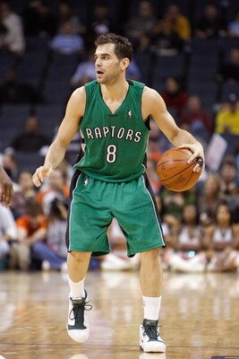 CHARLOTTE, NC - MARCH 16:  Jose Calderon #8 of the Toronto Raptors dribbles the ball against the Charlotte Bobcats during their game at Time Warner Cable Arena on March 16, 2009 in Charlotte, North Carolina.  NOTE TO USER: User expressly acknowledges and 