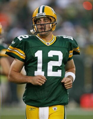 GREEN BAY, WI - SEPTEMBER 13: Aaron Rodgers #12 of the Green Bay Packers participates in warm-ups before a game against the Chicago Bears on September 13, 2009 at Lambeau Field in Green Bay, Wisconsin. The Packers defeated the Bears 21-15.  (Photo by Jona