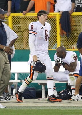 GREEN BAY, WI - SEPTEMBER 13: Jay Cutler #6 of the Chicago Bears walks back to the bench after throwing a career-high 4th interception against the Green Bay Packers on September 13, 2009 at Lambeau Field in Green Bay, Wisconsin. The Packers defeated the B