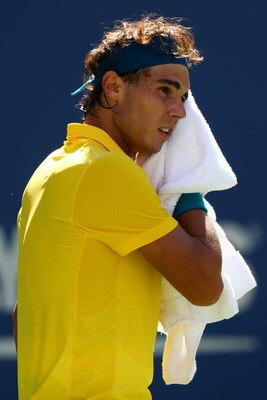 NEW YORK - SEPTEMBER 13:  Rafael Nadal of Spain wipes his brow during the Men�s Singles Semifinal match against Juan Martin Del Potro of Argentina on day fourteen of the 2009 U.S. Open at the USTA Billie Jean King National Tennis Center on September 13, 2
