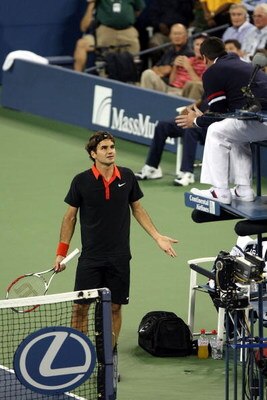 NEW YORK - SEPTEMBER 14:  Roger Federer of Switzerland (L) disputes a call in the fourth set tiebreak to chair judge Jake Garner during the Men�s Singles final on day fifteen of the 2009 U.S. Open at the USTA Billie Jean King National Tennis Center on Sep