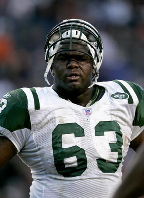 DENVER - NOVEMBER 20: Defensive tackle Dewayne Robertson #63 of the New York Jets watches the game against the Denver Broncos on November 20, 2005 at Invesco Field at Mile High in Denver, Colorado. The Broncos won 27-0. (Photo by Brian Bahr/Getty Image