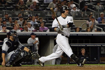 NEW YORK - SEPTEMBER 08:  Nick Swisher #33 of the New York Yankees follows through on his game winning walk off home run against the Tampa Bay Rays on September 8, 2009 at Yankee Stadium in the Bronx borough of New York City. The Yankees won the game 3-2.
