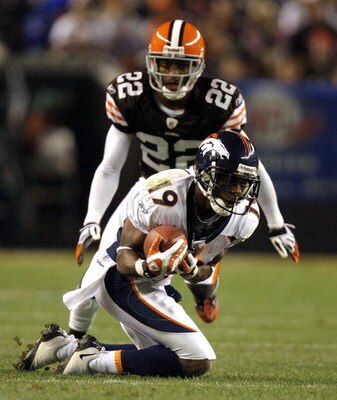 CLEVELAND - NOVEMBER 6:  Eddie Royal #19 of the Denver Broncos catches a pass in front of Brandon McDonald #22 of the Cleveland Browns during the third quarter of their NFL game at Cleveland Browns Stadium November 6, 2008 in Cleveland, Ohio.  (Photo by M
