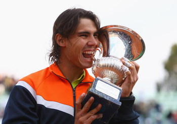 ROME - MAY 03: Rafael Nadal of Spain bites the trophy after defeating Novak Djokovic of Serbia during day seven of the Foro Italico Tennis Masters on May 3, 2009 in Rome, Italy. (Photo by Julian Finney/Getty Images)